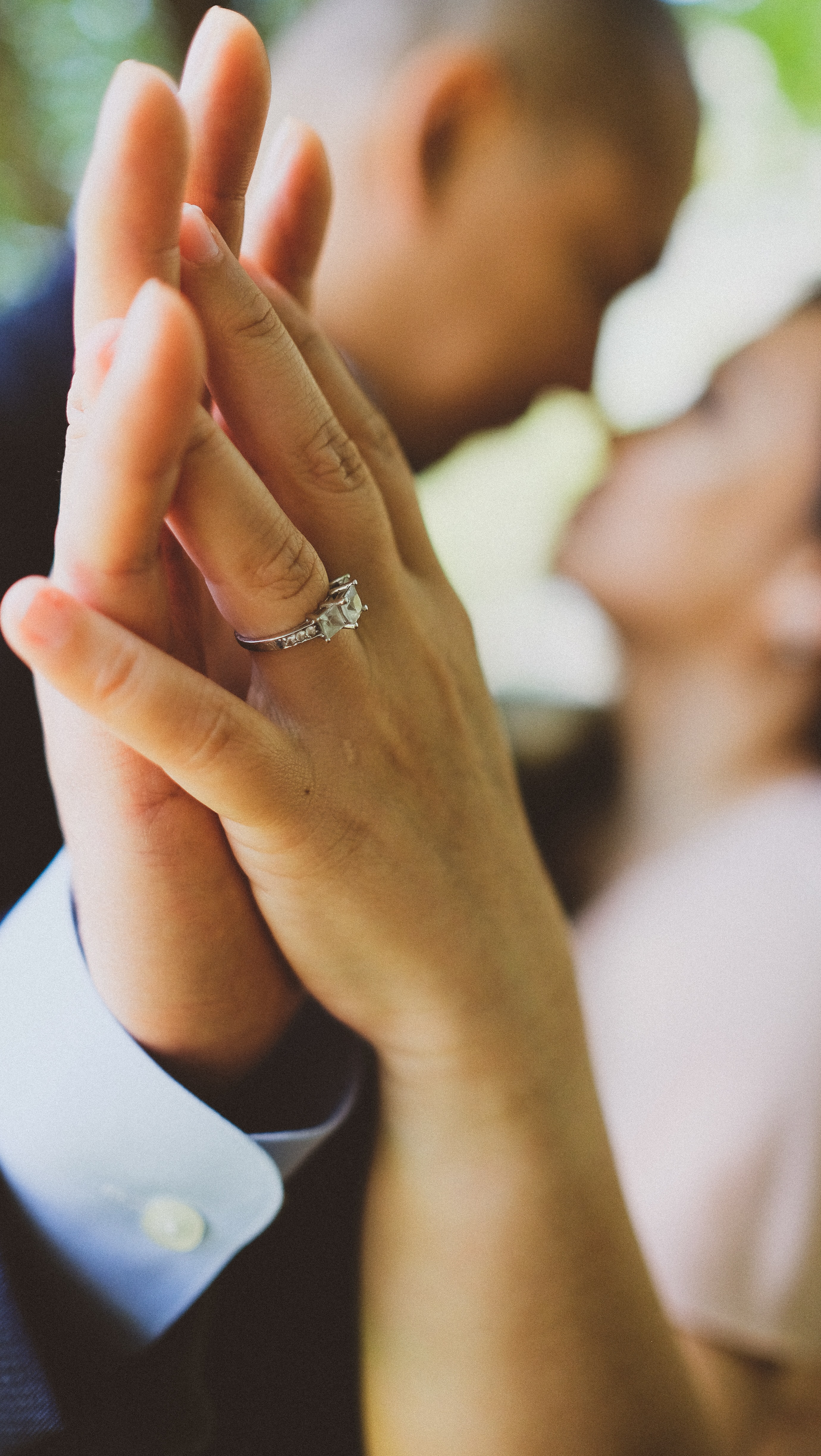 couple holding hands with antique diamond ring - Vintage Engagement Rings