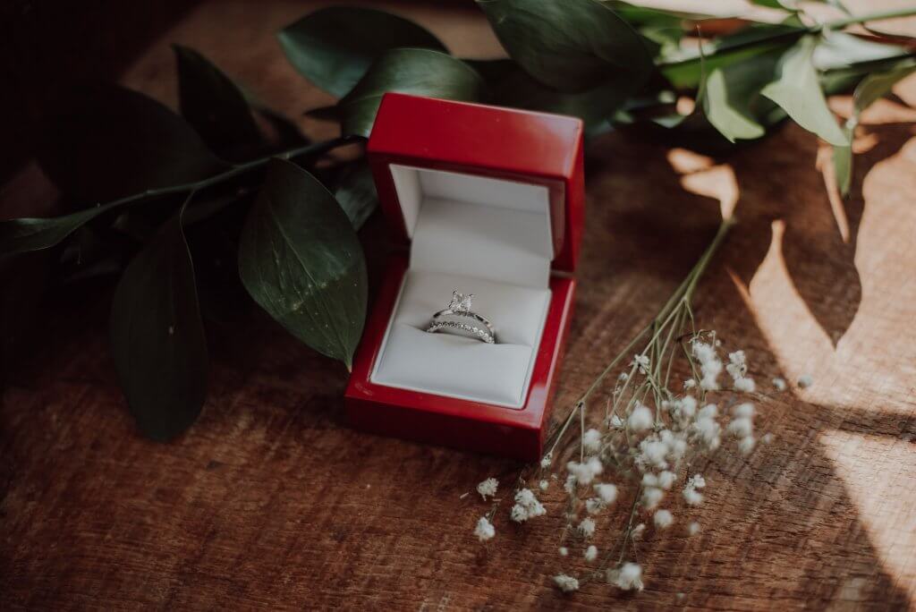 cushion cut diamond ring, wedding ring in ring box 