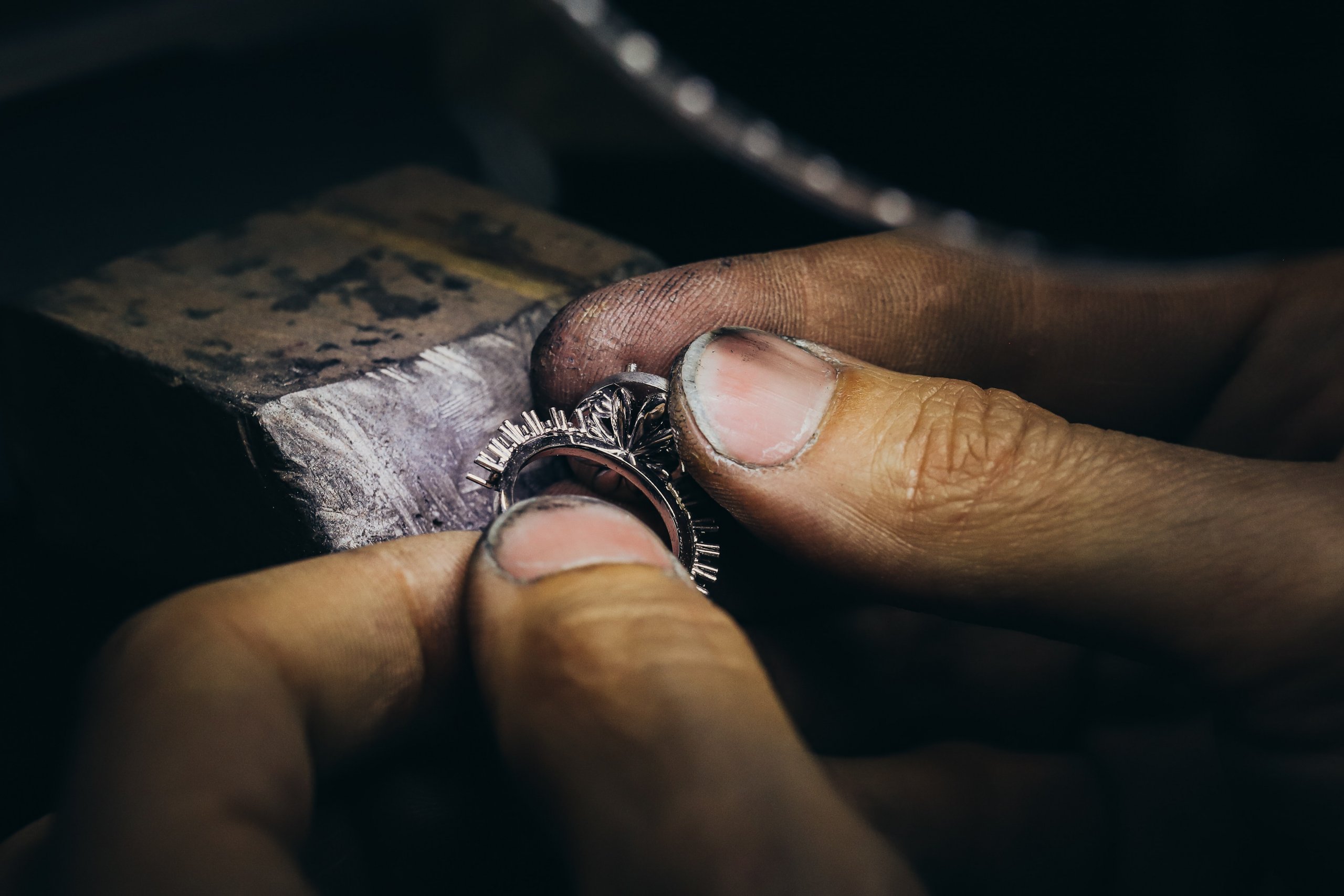 jeweler creating diamond ring - The Pavé Setting