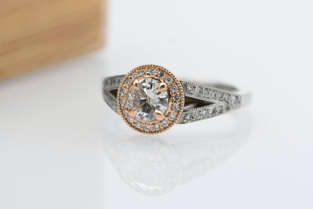 round diamond halo rose gold ring in white gold