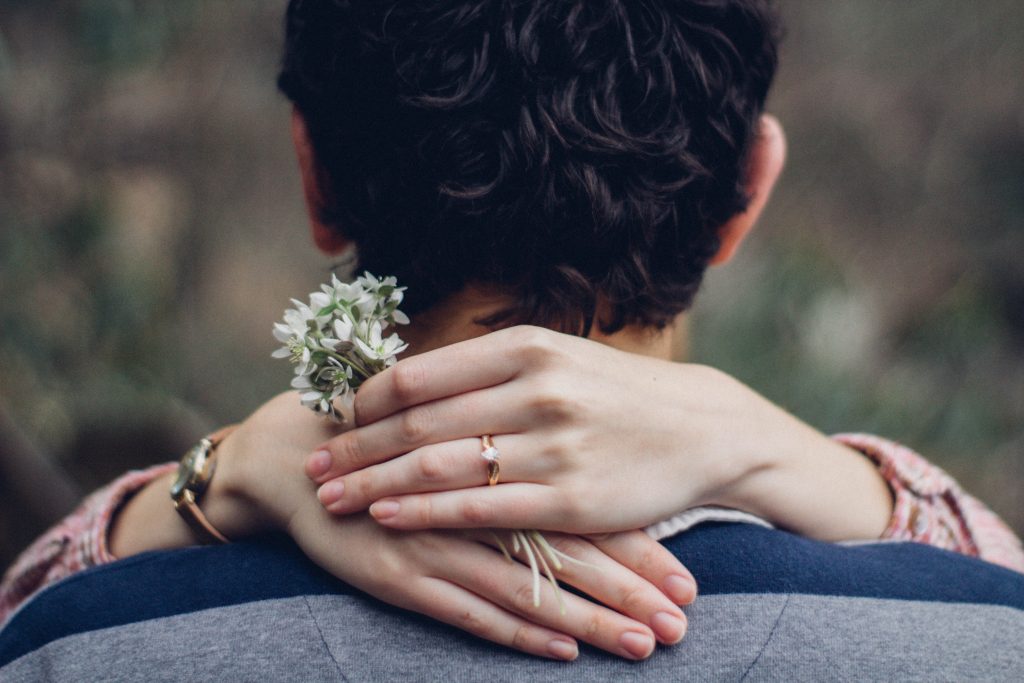 woman hug man with diamond engagnement ring - How to Spend Your 10,000 Budget Wisely .jpg 