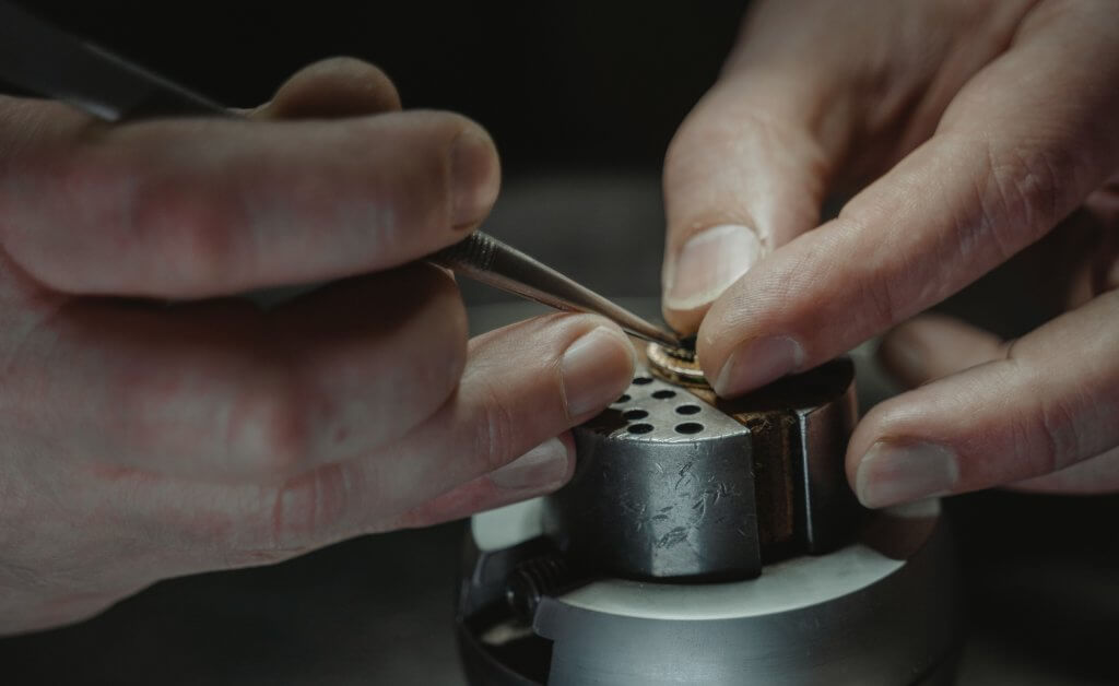 jeweler working gold ring 