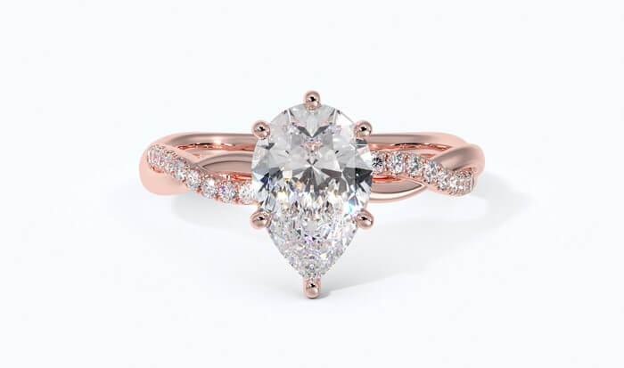 pear shaped engagement ring with-twisted band in rose gold front down 